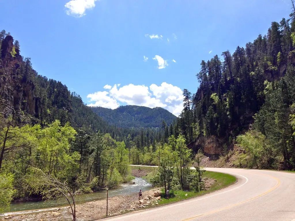 The Spearfish Canyon Scenic Byway curving beside Spearfish Creek under canyon walls